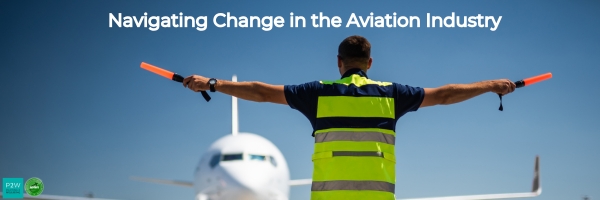 Airfield worker in high-visibility vest guides an approaching airplane with batons. Text reads "Navigating Change in the Aviation Industry.