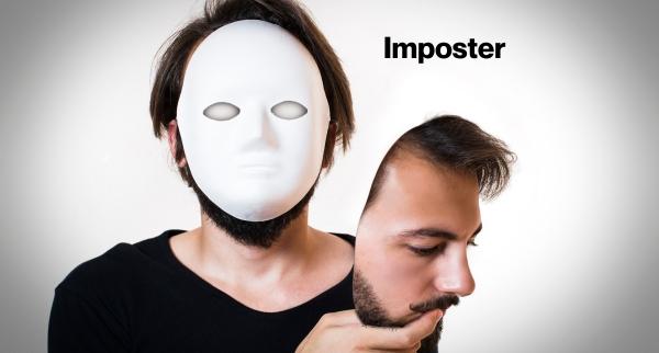 Person holding a mask in front of their face, with another face mask labeled "Imposter" held in their hand.