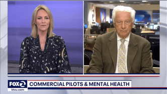 News segment on Fox 2 with two anchors discussing the topic of "Commercial Pilots & Mental Health.