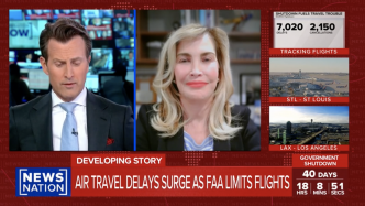 News broadcast showing two anchors discussing air travel delays; flight tracking statistics and airport images appear on screen, with headlines about FAA flight limits and government shutdown.